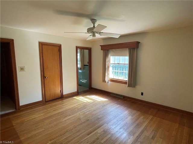 1706 Windsor Dr, High Point, NC 27262 - unfurnished bedroom with light wood-style flooring, baseboards, and ceiling fan