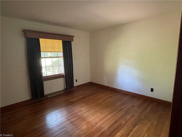 1706 Windsor Dr, High Point, NC 27262 - spare room featuring dark wood-style floors and baseboards
