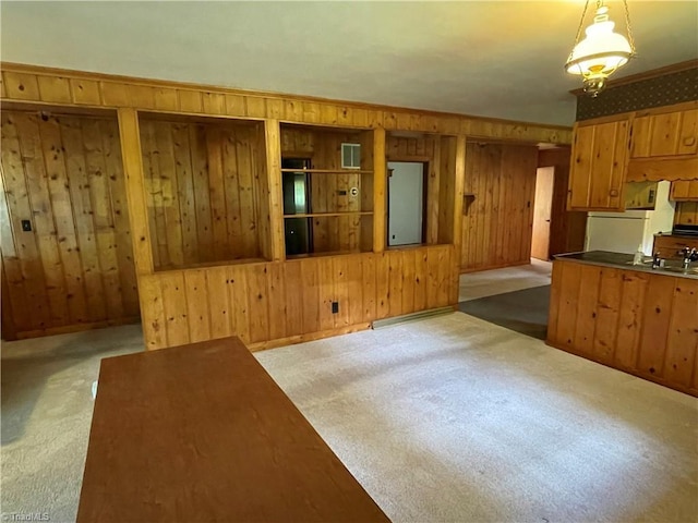1706 Windsor Dr, High Point, NC 27262 - kitchen with wooden walls, carpet flooring, and pendant lighting
