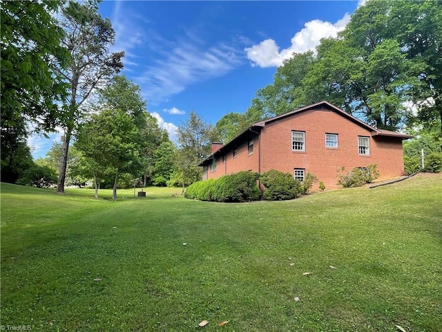 1706 Windsor Dr, High Point, NC 27262 - view of side of property featuring a yard and brick siding