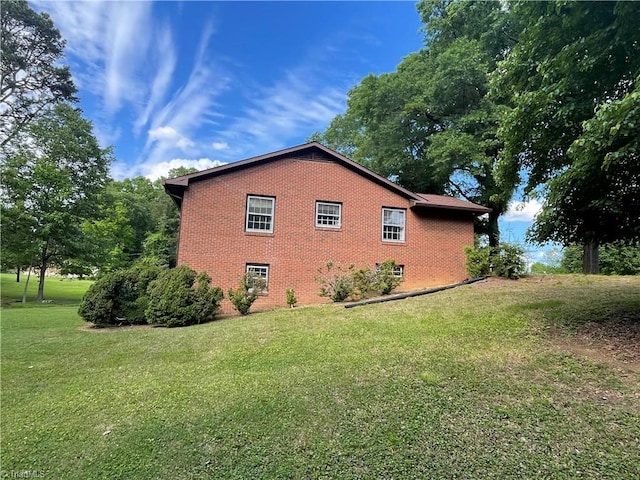 1706 Windsor Dr, High Point, NC 27262 - view of home's exterior with brick siding and a yard