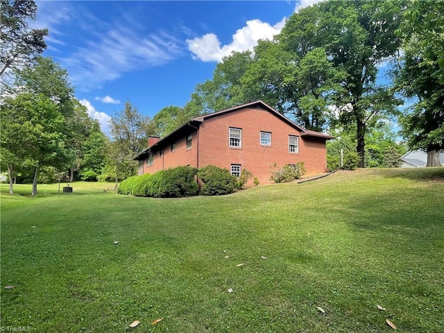 1706 Windsor Dr, High Point, NC 27262 - view of side of property with a lawn and brick siding