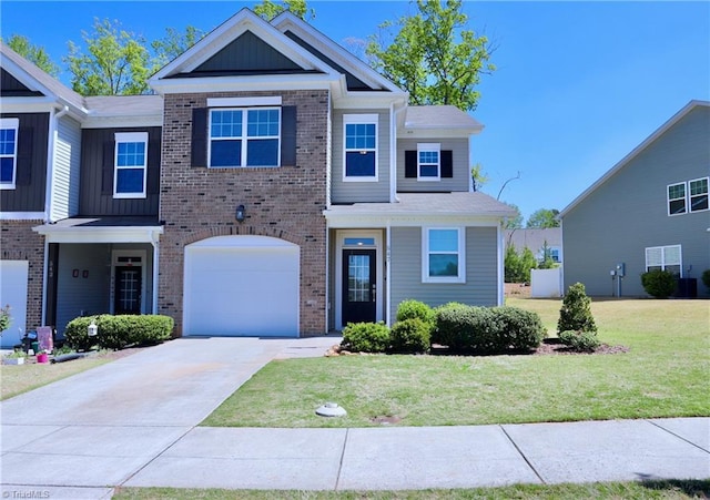 547 Historic Dr, Hillsborough, NC 27278 - view of front of house featuring brick siding, a garage, a front yard, and concrete driveway