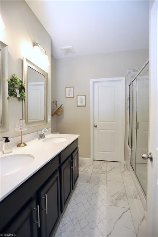 547 Historic Dr, Hillsborough, NC 27278 - full bathroom featuring marble finish floor, a sink, a shower stall, and double vanity