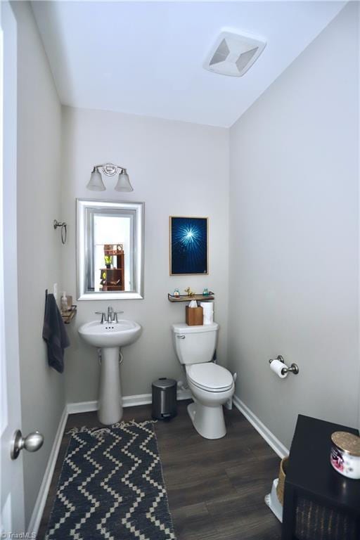 547 Historic Dr, Hillsborough, NC 27278 - half bath with baseboards, wood finished floors, and toilet