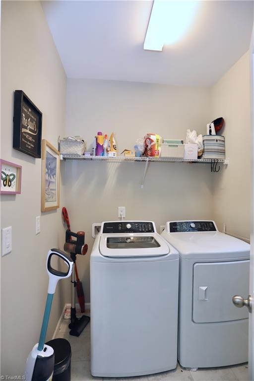 547 Historic Dr, Hillsborough, NC 27278 - laundry area featuring baseboards, washer and dryer, and laundry area