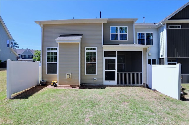 547 Historic Dr, Hillsborough, NC 27278 - back of house featuring a sunroom, fence, and a lawn