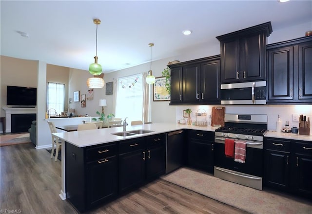 547 Historic Dr, Hillsborough, NC 27278 - kitchen featuring a peninsula, light countertops, appliances with stainless steel finishes, and a sink