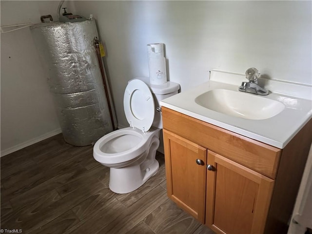 116 Kearns St, Jamestown, NC 27282 - bathroom with vanity, toilet, and wood finished floors
