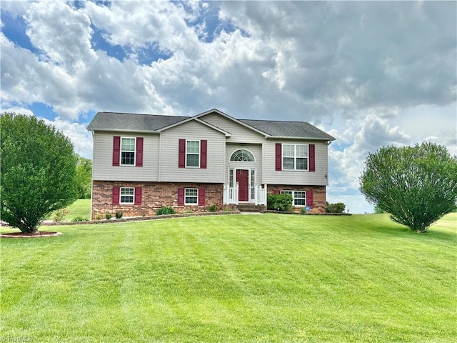 155 Page Farm Rd, Mount Airy, NC 27030 - split foyer home featuring a front lawn and brick siding