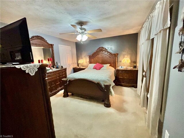 155 Page Farm Rd, Mount Airy, NC 27030 - bedroom featuring a textured ceiling, light carpet, and a ceiling fan