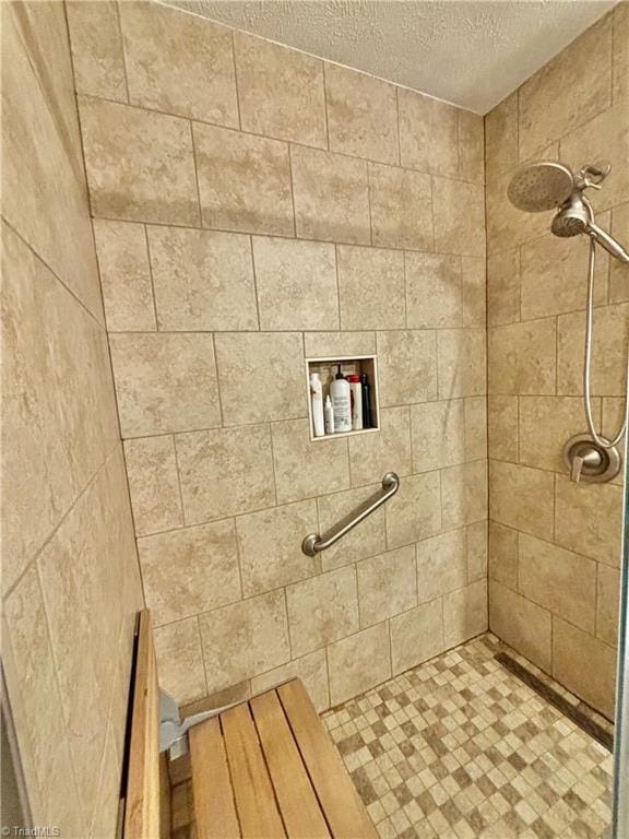 155 Page Farm Rd, Mount Airy, NC 27030 - bathroom featuring a textured ceiling and tiled shower