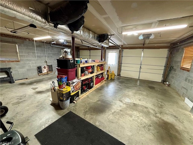 155 Page Farm Rd, Mount Airy, NC 27030 - garage featuring concrete block wall and a garage door opener