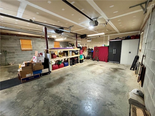 155 Page Farm Rd, Mount Airy, NC 27030 - garage featuring a garage door opener and concrete block wall