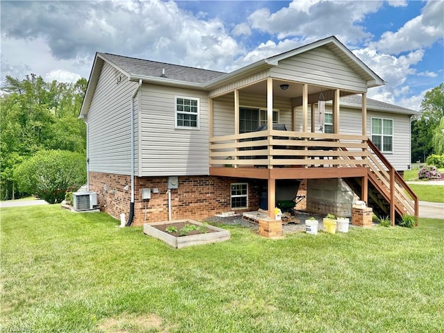 155 Page Farm Rd, Mount Airy, NC 27030 - rear view of house featuring a yard, a wooden deck, and central AC unit