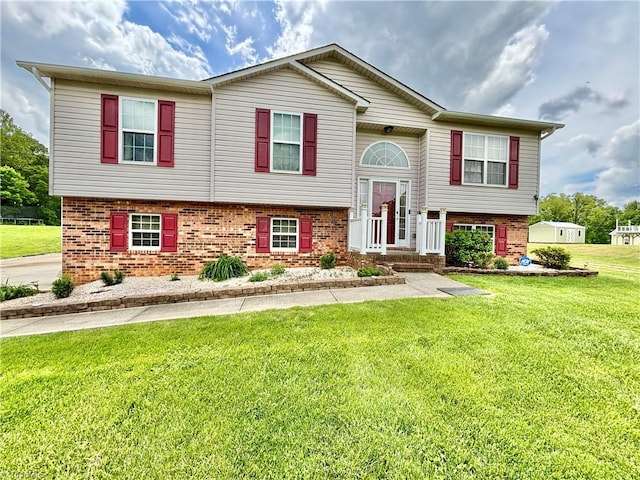 155 Page Farm Rd, Mount Airy, NC 27030 - raised ranch featuring a front lawn and brick siding