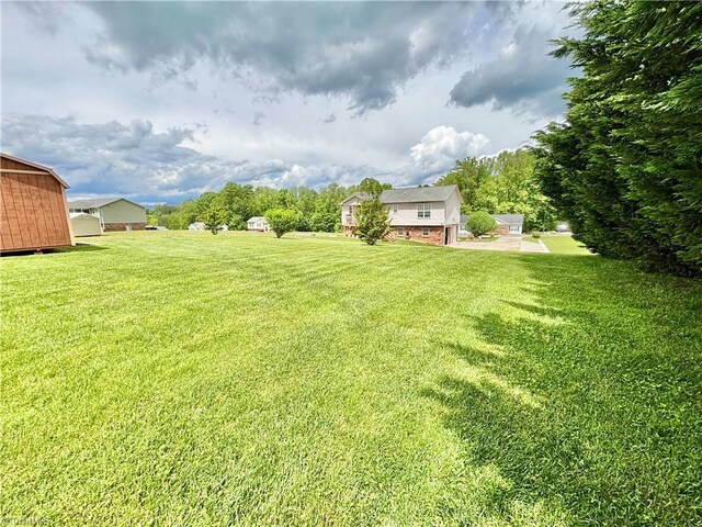 155 Page Farm Rd, Mount Airy, NC 27030 - view of yard featuring a storage unit and an outdoor structure