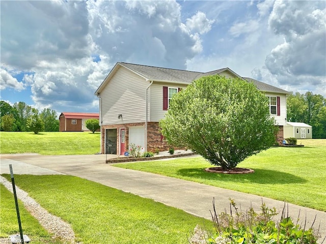 155 Page Farm Rd, Mount Airy, NC 27030 - view of front of house featuring an attached garage, concrete driveway, brick siding, and a front yard