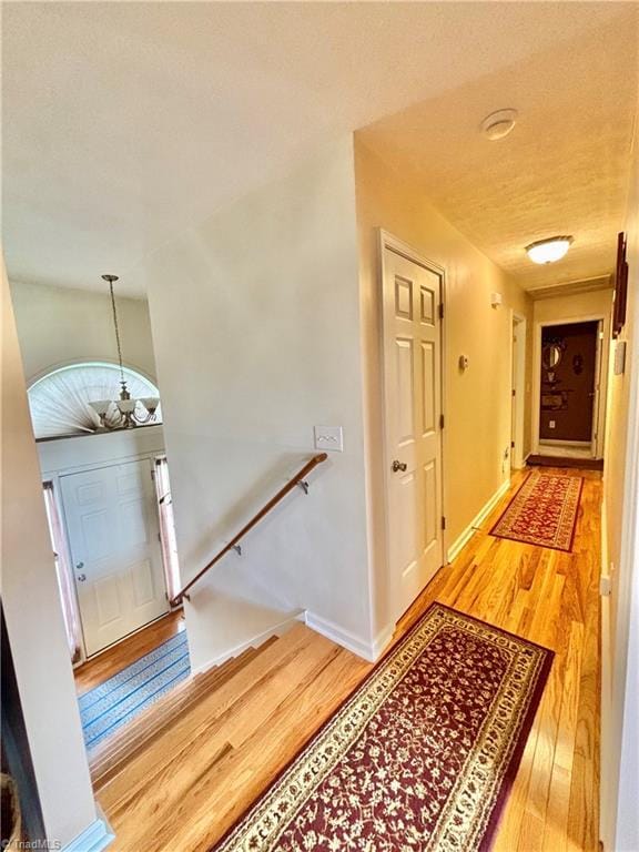 155 Page Farm Rd, Mount Airy, NC 27030 - foyer entrance featuring baseboards, an inviting chandelier, and wood finished floors