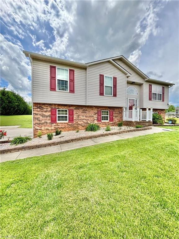 155 Page Farm Rd, Mount Airy, NC 27030 - bi-level home featuring brick siding and a front yard