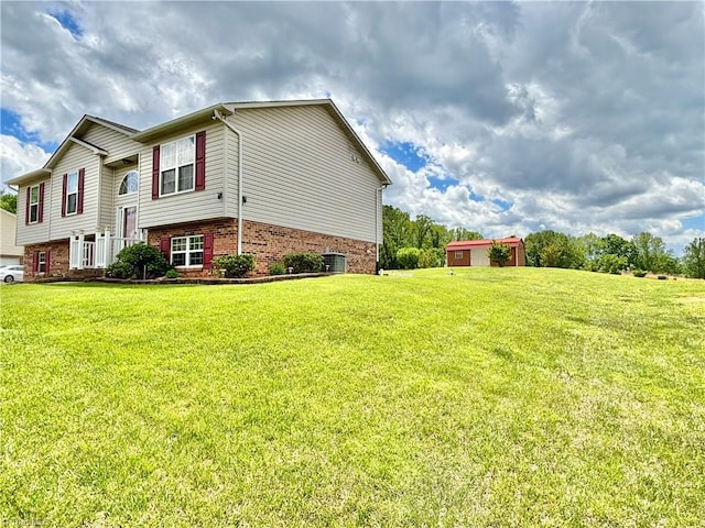 155 Page Farm Rd, Mount Airy, NC 27030 - view of home's exterior featuring a yard and brick siding