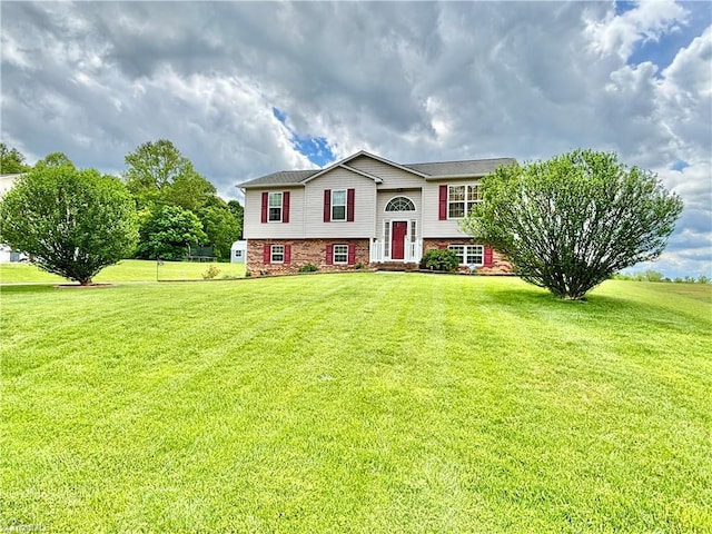 155 Page Farm Rd, Mount Airy, NC 27030 - split foyer home featuring a front lawn and brick siding