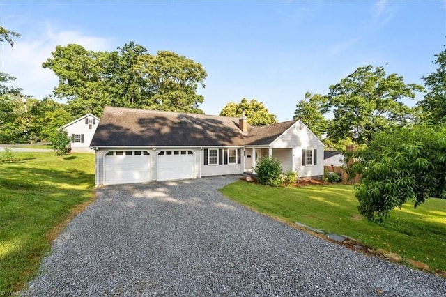 134 Shamrock Rd, Asheboro, NC 27203 - view of front of home with gravel driveway, a garage, a front yard, and a chimney