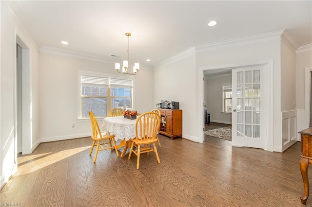 7722 NW Meadows Dr, Stokesdale, NC 27357 - dining room with a chandelier, wood finished floors, ornamental molding, and recessed lighting