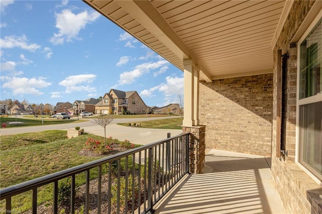 7722 NW Meadows Dr, Stokesdale, NC 27357 - covered porch featuring a residential view