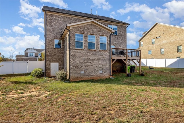 7722 NW Meadows Dr, Stokesdale, NC 27357 - rear view of property with a deck, a fenced backyard, and brick siding
