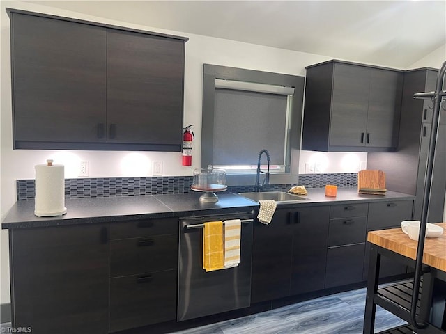 2042 Harrison Ave, Winston-Salem, NC 27105 - kitchen featuring dark countertops, dishwasher, modern cabinets, light wood finished floors, and tasteful backsplash