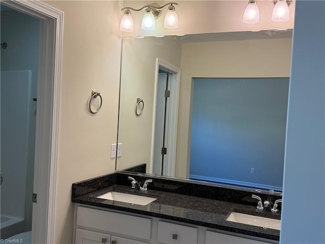 full bath featuring a sink and double vanity