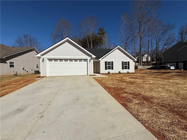 view of front of property with concrete driveway, an attached garage, and central air condition unit