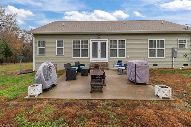 rear view of property with french doors, an outdoor hangout area, and a patio area