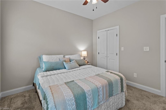 bedroom with ceiling fan, a closet, and carpet