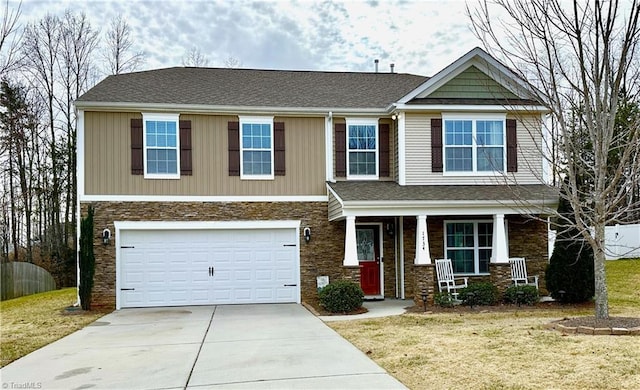 craftsman-style home with a garage, a porch, and a front lawn