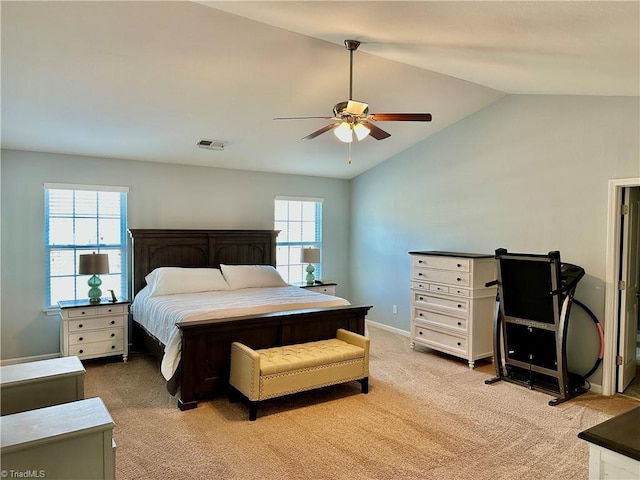 carpeted bedroom with lofted ceiling and ceiling fan