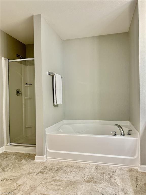 bathroom with independent shower and bath