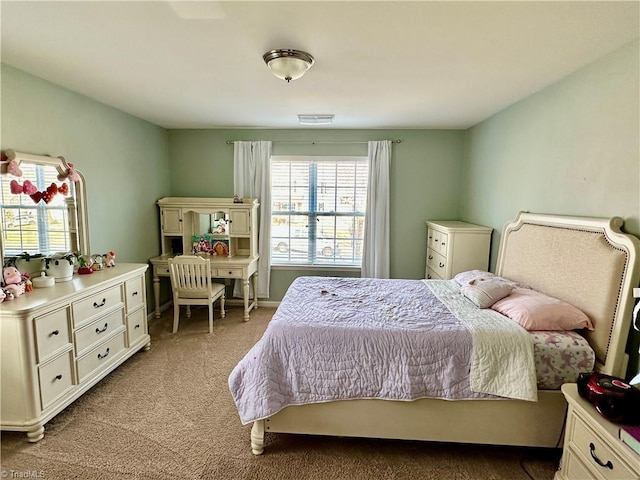 bedroom with light carpet