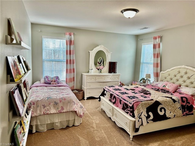 bedroom with light colored carpet