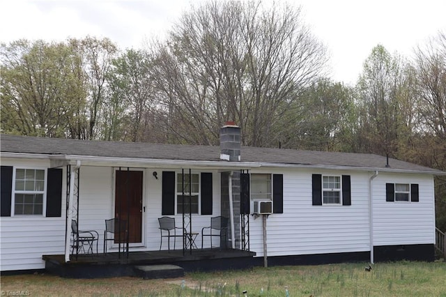 84 Sol Nunnally Rd, Pelham, NC 27311 - ranch-style house with covered porch and a chimney