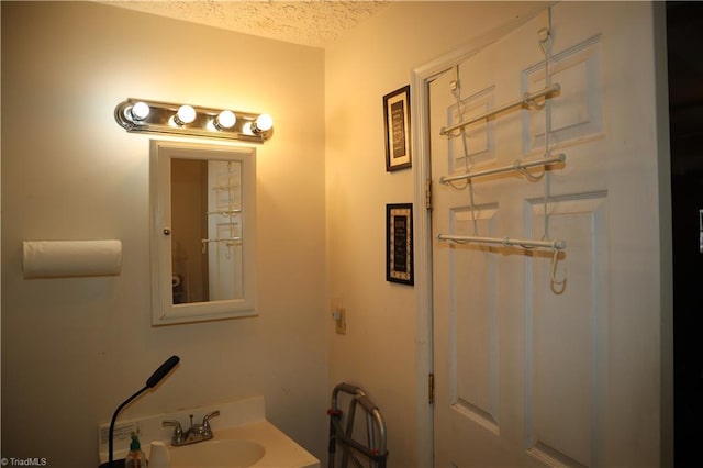 84 Sol Nunnally Rd, Pelham, NC 27311 - bathroom with a sink and a textured ceiling