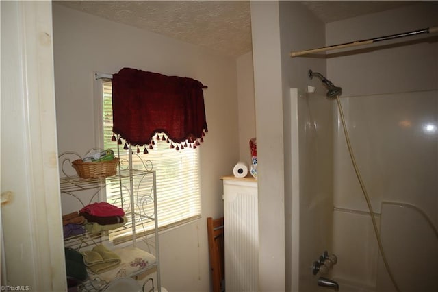 84 Sol Nunnally Rd, Pelham, NC 27311 - bathroom with a textured ceiling and shower / bathtub combination