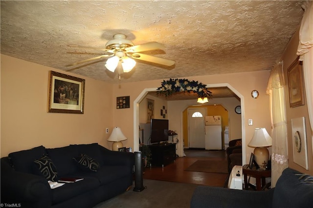 84 Sol Nunnally Rd, Pelham, NC 27311 - living room with arched walkways, a ceiling fan, and a textured ceiling