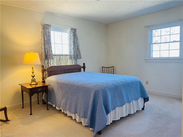 bedroom with carpet flooring and baseboards