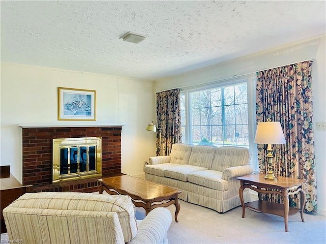 living room featuring carpet flooring, a brick fireplace, and a textured ceiling