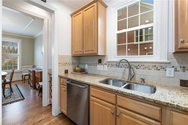 kitchen featuring sink, crown molding, light hardwood / wood-style flooring, dishwasher, and light stone countertops