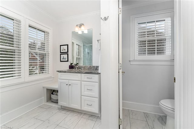 bathroom featuring vanity, ornamental molding, toilet, and walk in shower