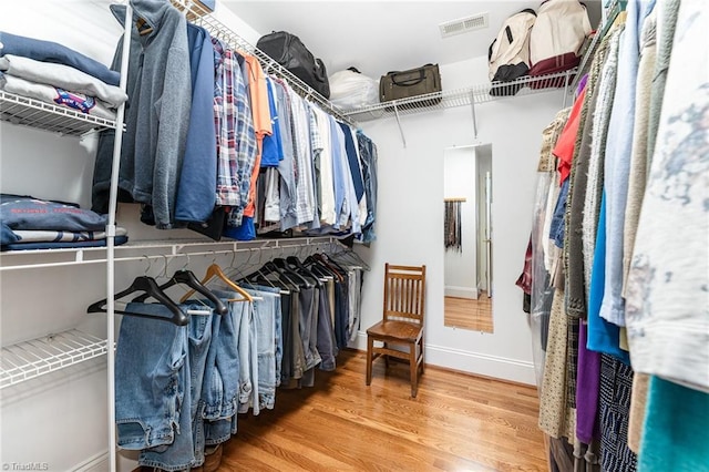 walk in closet featuring hardwood / wood-style flooring