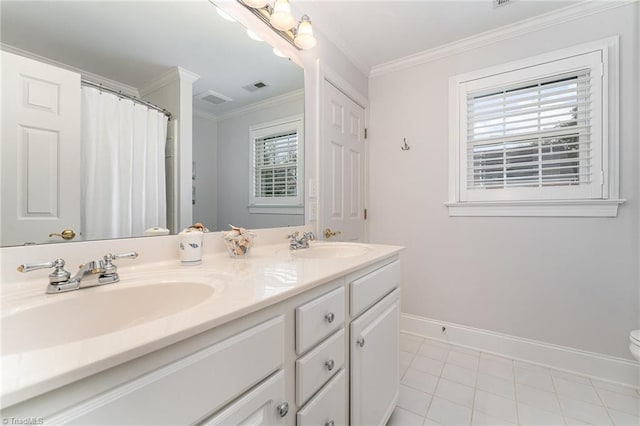 bathroom featuring crown molding, vanity, toilet, and tile patterned flooring